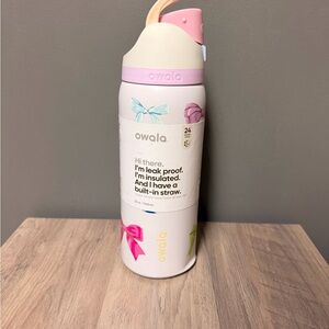 Owala 32oz Pink Bow Edition Freesip dented but stands just fine.